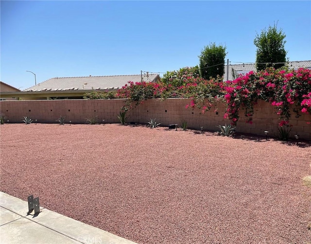 view of yard featuring a fenced backyard