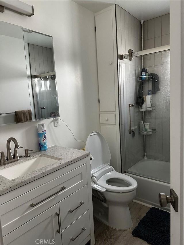 1941 Mentone Ave, Pasadena, CA 91103 - full bathroom featuring wood finished floors, toilet, vanity, and bathing tub / shower combination