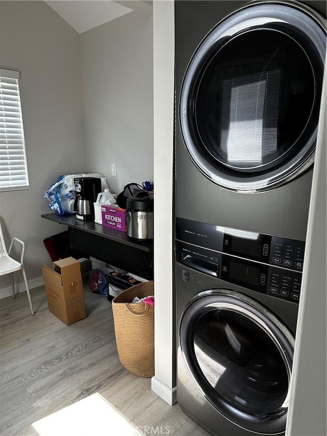 1941 Mentone Ave, Pasadena, CA 91103 - washroom with baseboards, stacked washer and clothes dryer, wood finished floors, and laundry area