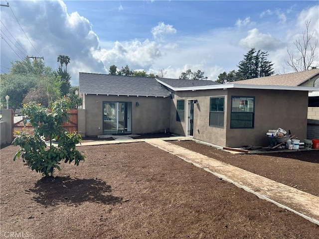 1941 Mentone Ave, Pasadena, CA 91103 - back of property featuring a shingled roof, stucco siding, and fence