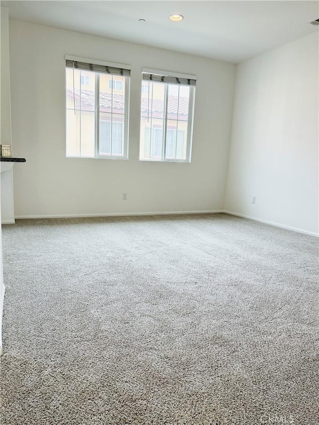 8054 Cresta Bella Rd, Rancho Cucamonga, CA 91730 - unfurnished room featuring a healthy amount of sunlight, carpet floors, baseboards, and recessed lighting