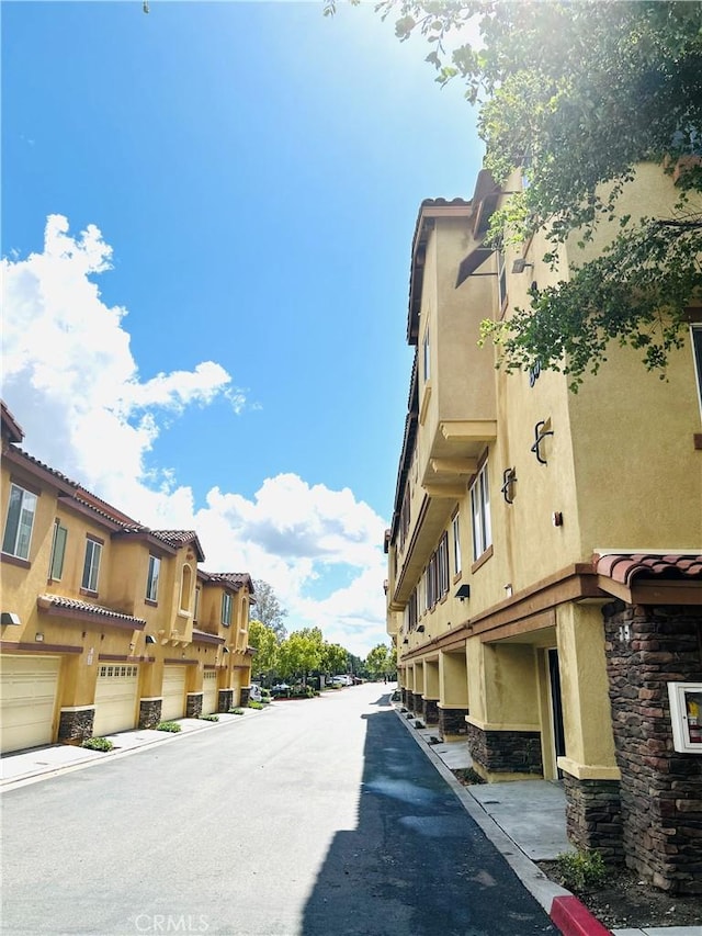 8054 Cresta Bella Rd, Rancho Cucamonga, CA 91730 - view of road featuring a residential view