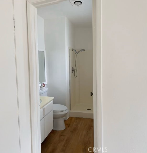 9620 Sepulveda Blvd Unit 35, North Hills, CA 91343 - full bathroom with toilet, wood finished floors, vanity, and a stall shower