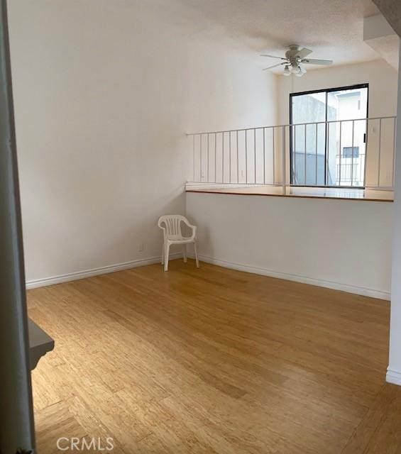 9620 Sepulveda Blvd Unit 35, North Hills, CA 91343 - empty room with ceiling fan, wood finished floors, and baseboards