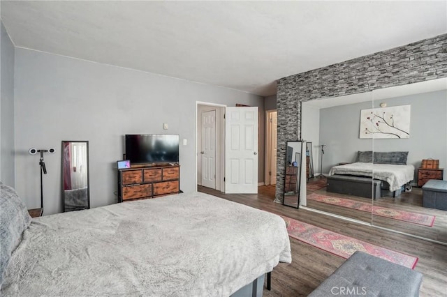 bedroom featuring wood finished floors