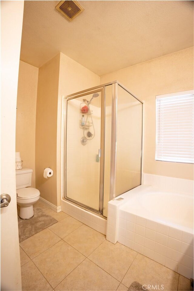 13025 Glendale Pl, Victorville, CA 92392 - bathroom featuring tile patterned flooring, a shower stall, toilet, and a bath