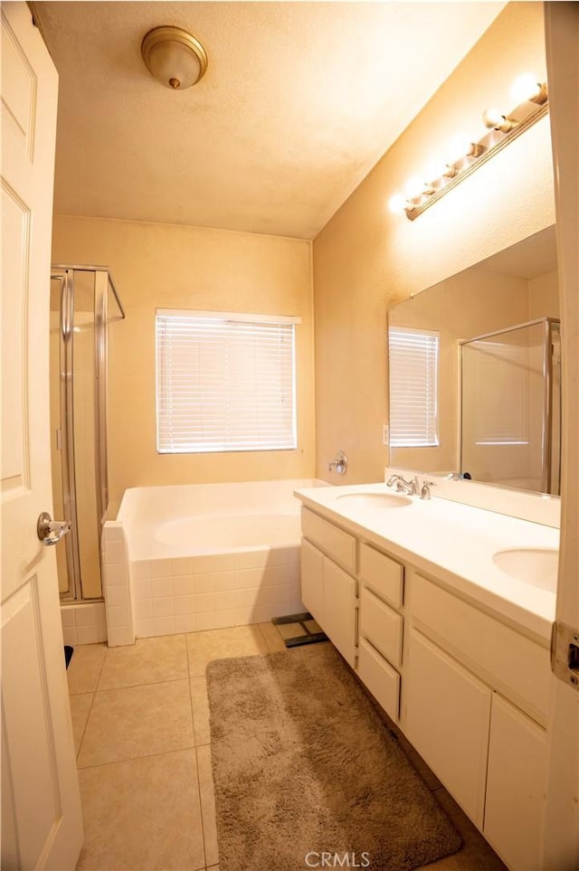 13025 Glendale Pl, Victorville, CA 92392 - full bathroom with a shower stall, a bath, double vanity, and tile patterned floors