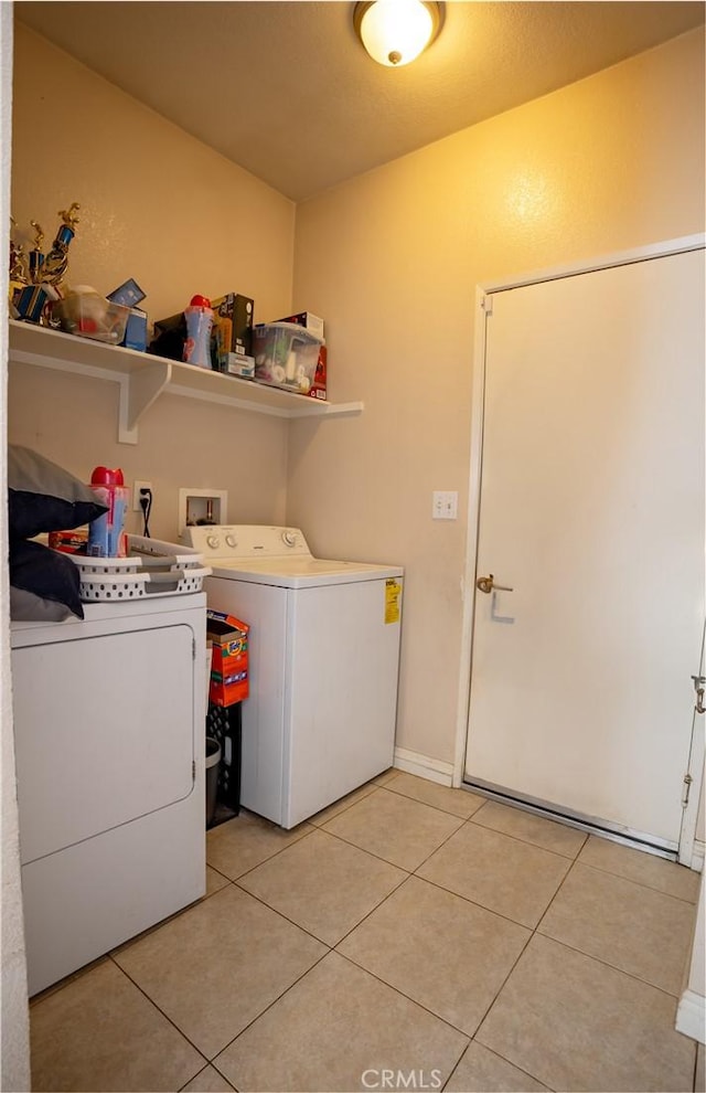 13025 Glendale Pl, Victorville, CA 92392 - laundry area featuring washer and clothes dryer and light tile patterned floors