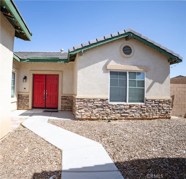 13025 Glendale Pl, Victorville, CA 92392 - view of exterior entry featuring stone siding and stucco siding