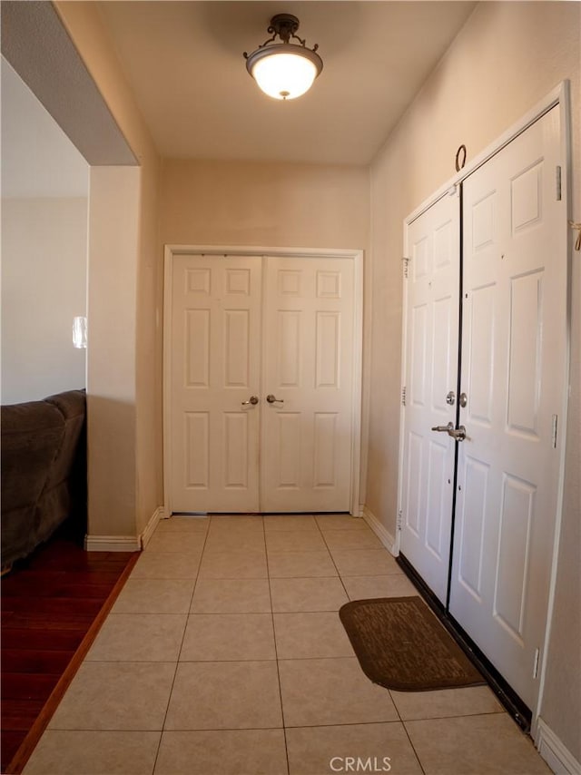 13025 Glendale Pl, Victorville, CA 92392 - foyer with baseboards and light tile patterned flooring