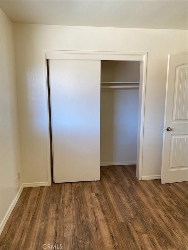 4772 Dwight St Unit 4770, San Diego, CA 92105 - unfurnished bedroom with wood finished floors and a closet