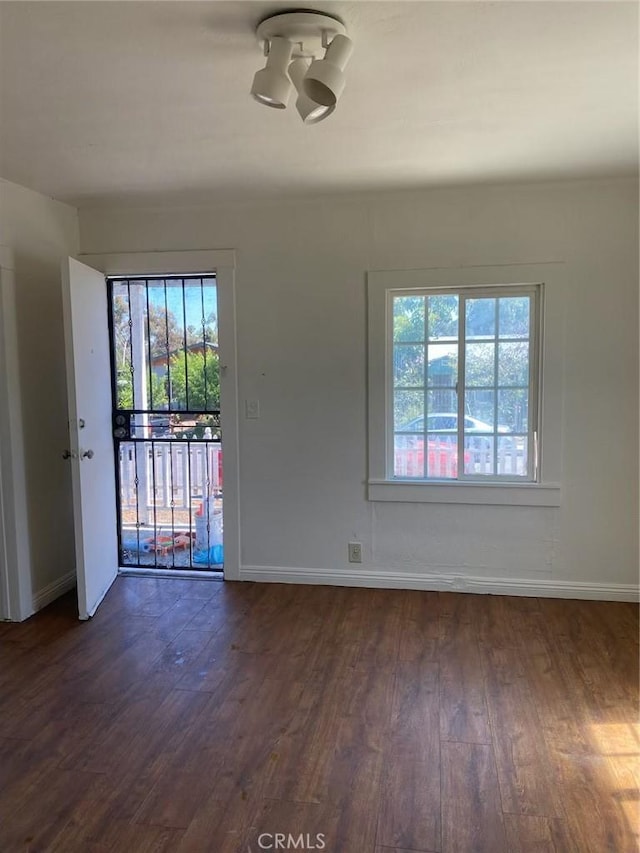 4772 Dwight St Unit 4770, San Diego, CA 92105 - unfurnished room featuring healthy amount of natural light and dark wood-style floors