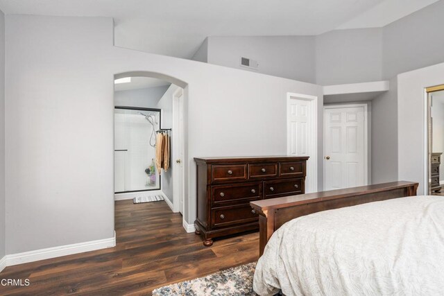 1144 Oriole Cir, Fillmore, CA 93015 - bedroom featuring arched walkways, dark wood finished floors, and high vaulted ceiling