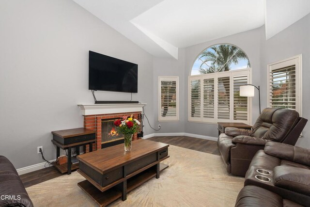 1144 Oriole Cir, Fillmore, CA 93015 - living room with vaulted ceiling, wood finished floors, and a fireplace