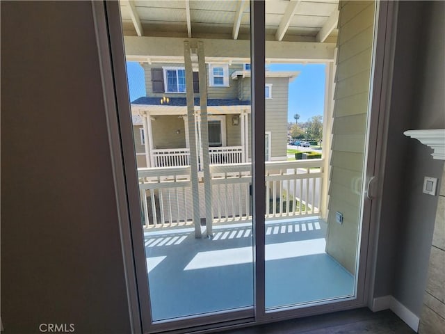 entryway featuring beamed ceiling
