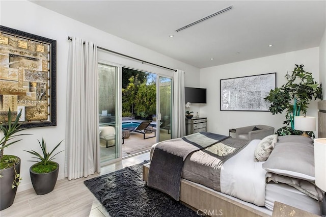 bedroom with recessed lighting, access to exterior, visible vents, and wood finished floors
