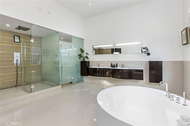 bathroom with tile patterned floors, a shower stall, recessed lighting, and a soaking tub