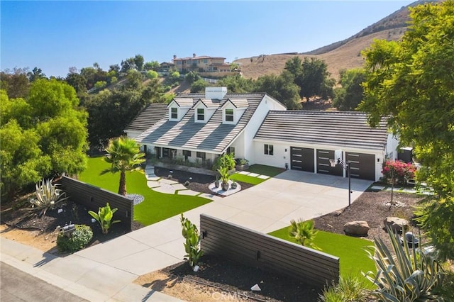 birds eye view of property with a mountain view