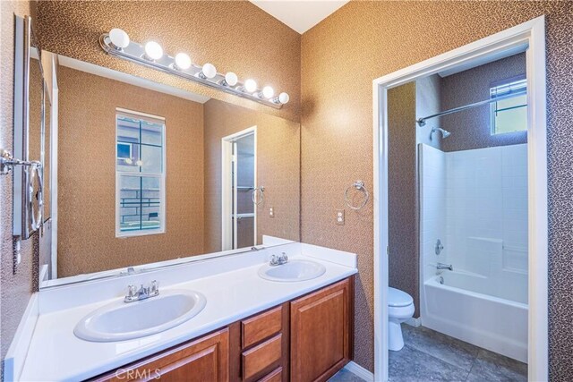 67960 Rio Vista Dr, Cathedral City, CA 92234 - bathroom featuring double vanity, shower / washtub combination, toilet, and a sink