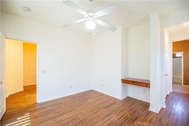 67960 Rio Vista Dr, Cathedral City, CA 92234 - empty room featuring ceiling fan, wood finished floors, and baseboards