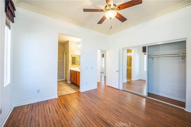 67960 Rio Vista Dr, Cathedral City, CA 92234 - unfurnished bedroom featuring ornamental molding, a closet, wood finished floors, and baseboards
