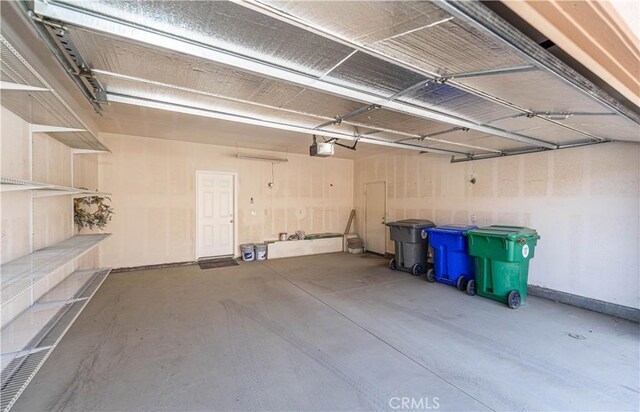67960 Rio Vista Dr, Cathedral City, CA 92234 - garage featuring a garage door opener