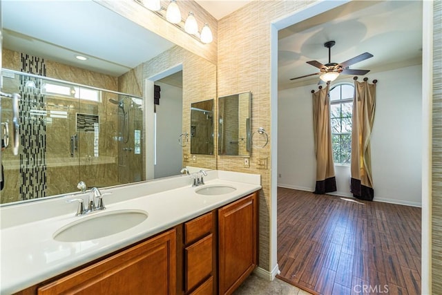 67960 Rio Vista Dr, Cathedral City, CA 92234 - bathroom with baseboards, a stall shower, ceiling fan, and a sink