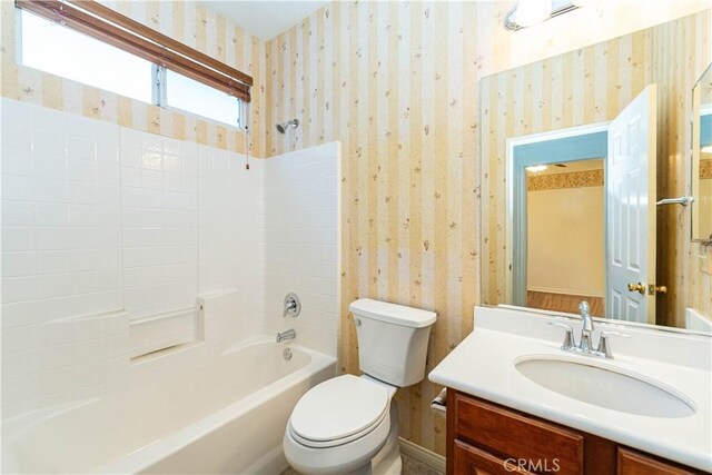 67960 Rio Vista Dr, Cathedral City, CA 92234 - full bathroom featuring toilet, shower / tub combination, wallpapered walls, and vanity