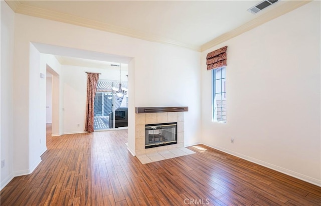 67960 Rio Vista Dr, Cathedral City, CA 92234 - unfurnished living room with hardwood / wood-style floors, visible vents, a notable chandelier, and plenty of natural light