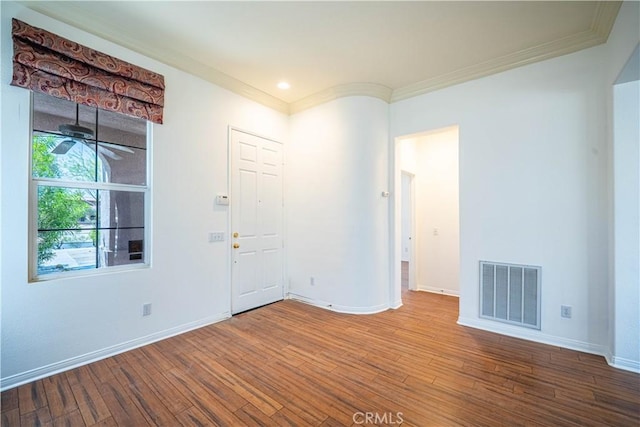 67960 Rio Vista Dr, Cathedral City, CA 92234 - spare room featuring wood finished floors, visible vents, crown molding, and baseboards