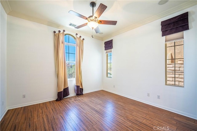 67960 Rio Vista Dr, Cathedral City, CA 92234 - spare room featuring a wealth of natural light, wood finished floors, ceiling fan, and crown molding