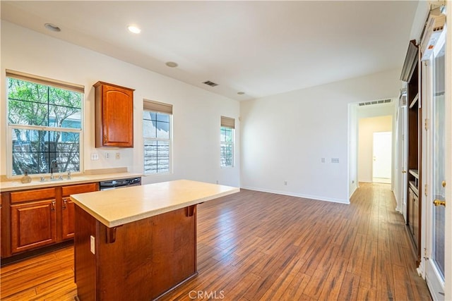 67960 Rio Vista Dr, Cathedral City, CA 92234 - kitchen with a sink, visible vents, light countertops, a center island, and dark wood finished floors