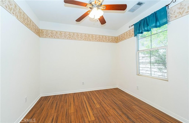 67960 Rio Vista Dr, Cathedral City, CA 92234 - empty room with visible vents, ceiling fan, dark wood finished floors, and baseboards