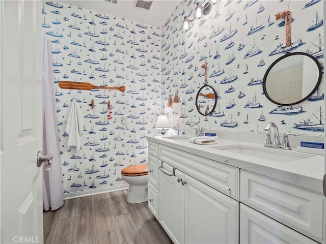 22458 Plantation Ct, Saugus, CA 91350 - full bath featuring a sink, toilet, wallpapered walls, and wood finished floors