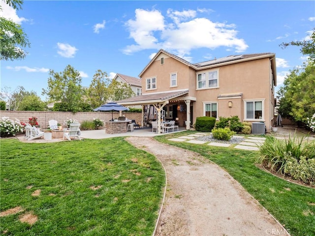 22458 Plantation Ct, Saugus, CA 91350 - rear view of property with a patio area, central AC unit, and a lawn