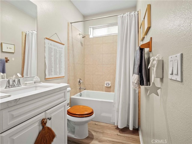 22458 Plantation Ct, Saugus, CA 91350 - bathroom with vanity, toilet, shower / bathtub combination with curtain, and wood finished floors