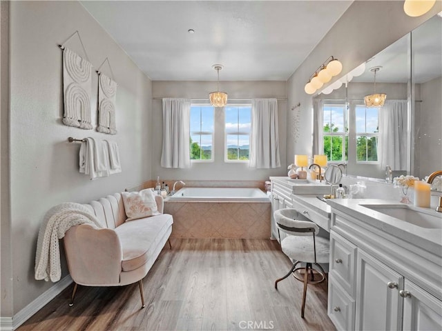 22458 Plantation Ct, Saugus, CA 91350 - full bath with a garden tub, wood finished floors, and vanity
