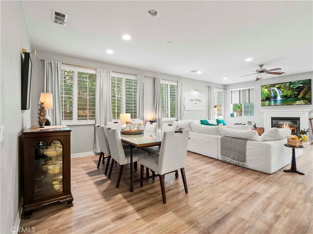 22458 Plantation Ct, Saugus, CA 91350 - dining area with light wood-style floors, a healthy amount of sunlight, and visible vents
