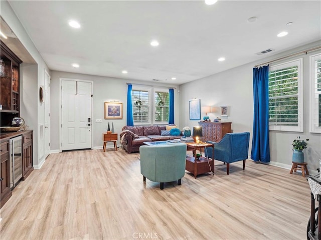 22458 Plantation Ct, Saugus, CA 91350 - living area with recessed lighting, beverage cooler, baseboards, visible vents, and light wood-type flooring