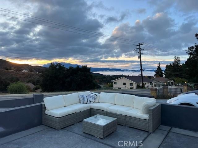 8491 Oak Glen Rd, Cherry Valley, CA 92223 - patio terrace at dusk with an outdoor living space and a patio area