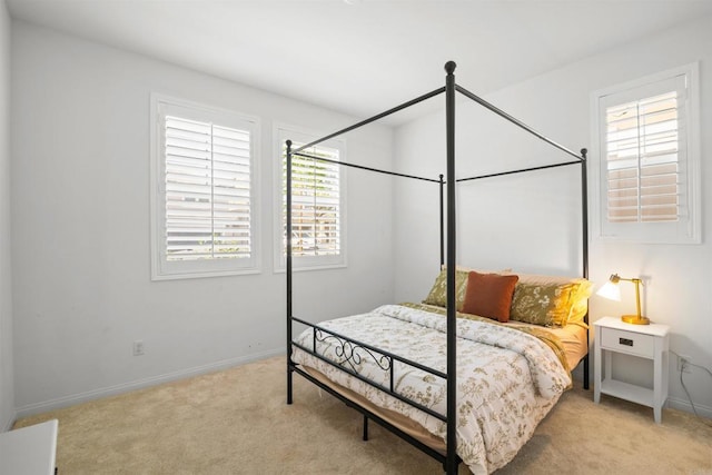 835 Orangedale Ave, Redlands, CA 92374 - bedroom with light colored carpet, baseboards, and multiple windows