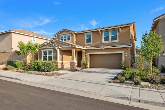 835 Orangedale Ave, Redlands, CA 92374 - view of front of house featuring concrete driveway, stone siding, an attached garage, and stucco siding