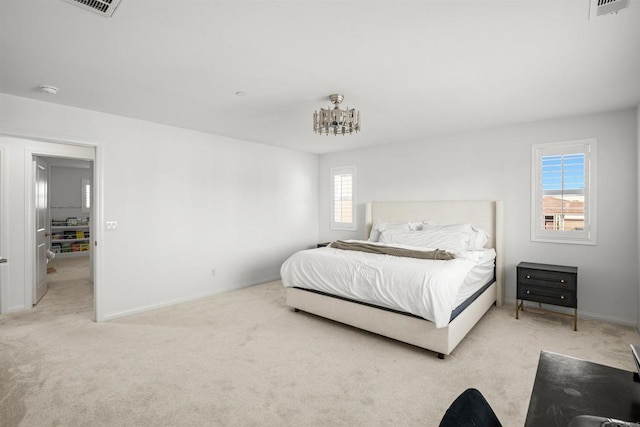835 Orangedale Ave, Redlands, CA 92374 - bedroom with an inviting chandelier, visible vents, light carpet, and baseboards