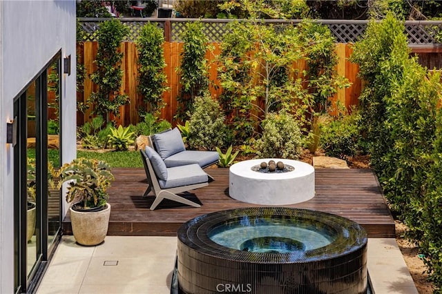 482 Costa Mesa St, Costa Mesa, CA 92627 - view of patio / terrace featuring a deck, a fenced backyard, and an outdoor hot tub