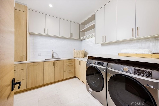 482 Costa Mesa St, Costa Mesa, CA 92627 - laundry area featuring washing machine and clothes dryer, cabinet space, and recessed lighting
