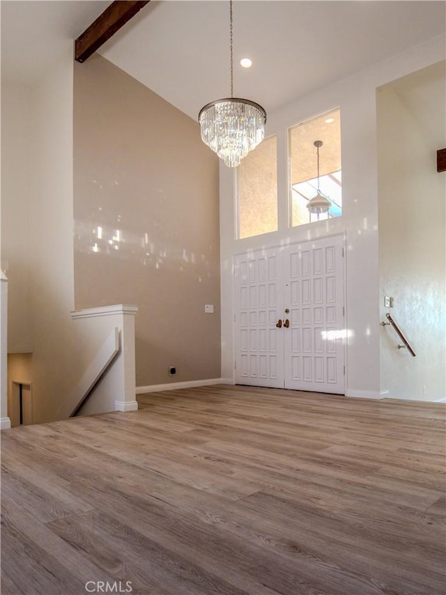 1446 Via Castilla, Palos Verdes Estates, CA 90274 - entrance foyer featuring high vaulted ceiling, wood finished floors, beamed ceiling, baseboards, and a chandelier