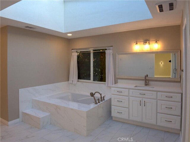 1446 Via Castilla, Palos Verdes Estates, CA 90274 - bathroom featuring marble look tiles, a garden tub, vanity, and recessed lighting