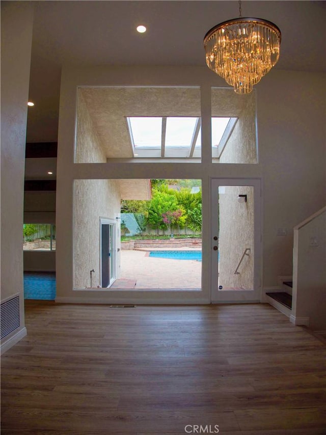 1446 Via Castilla, Palos Verdes Estates, CA 90274 - entryway with wood finished floors, stairs, a chandelier, baseboards, and a high ceiling