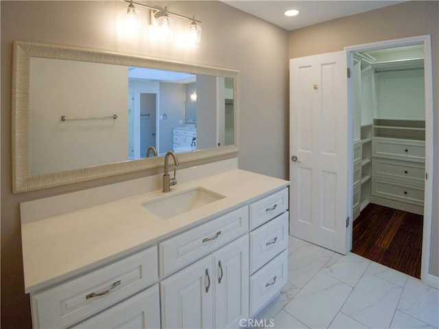 1446 Via Castilla, Palos Verdes Estates, CA 90274 - bathroom with vanity, recessed lighting, a walk in closet, and marble finish floors