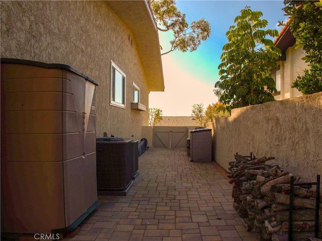 1446 Via Castilla, Palos Verdes Estates, CA 90274 - patio terrace at dusk with central AC, a patio area, and a gate